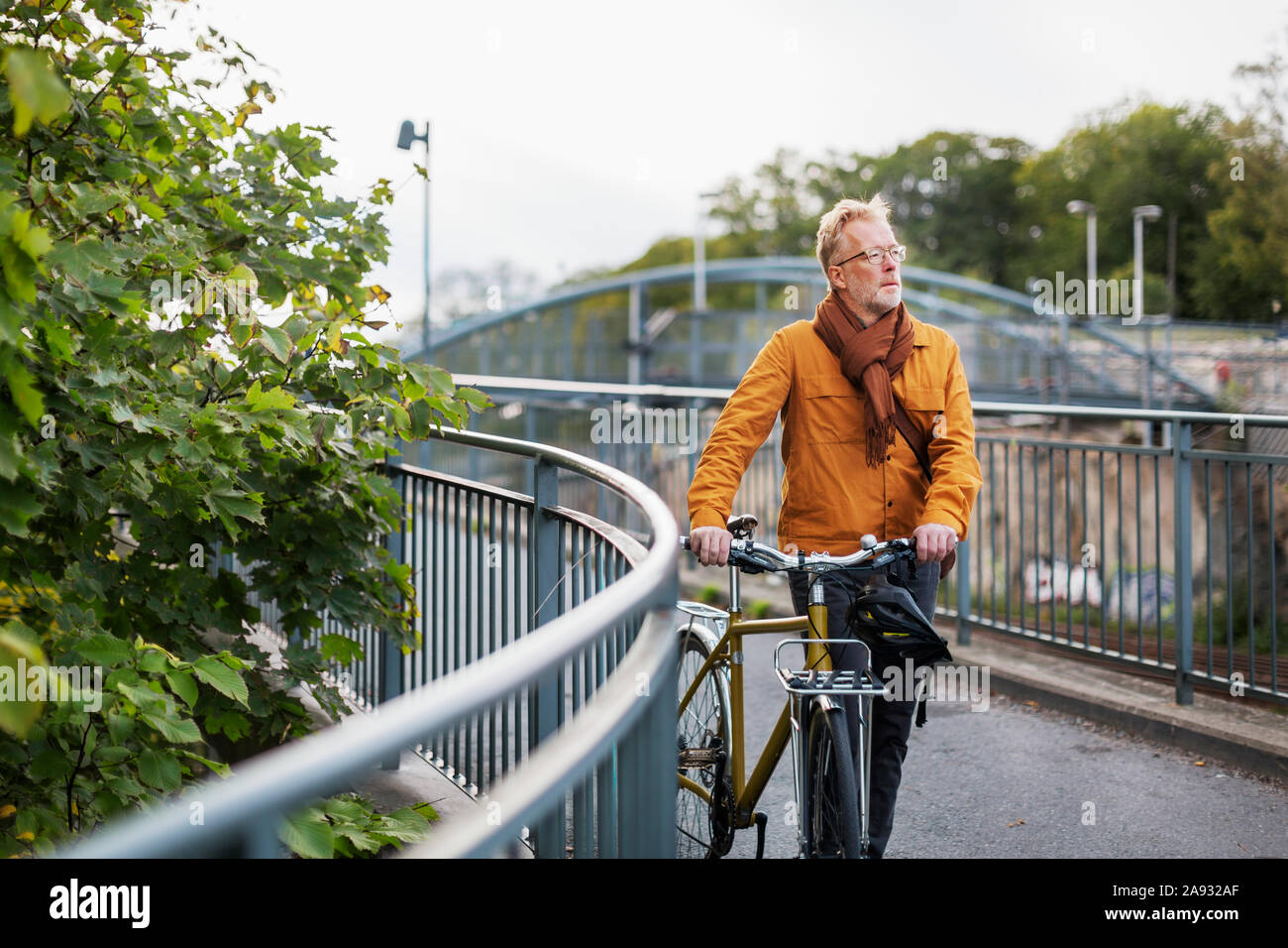 Mature man with bicycle Stock Photo