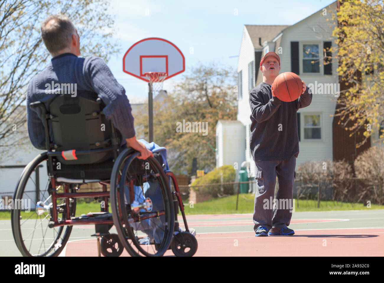 Father with Spinal Cord Injury and his son with Down Syndrome playing