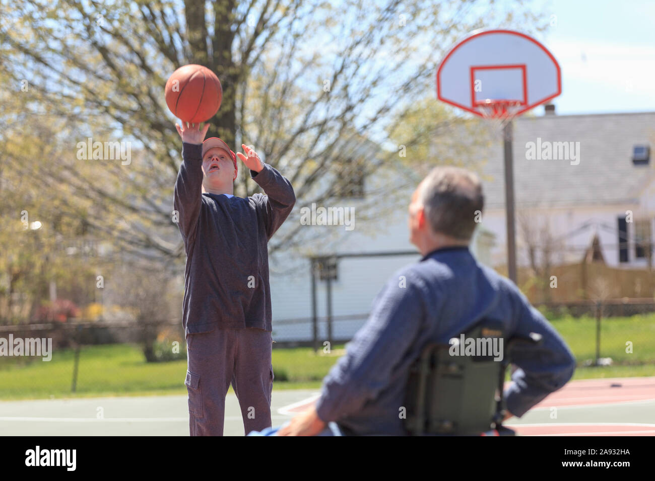 Father with Spinal Cord Injury and his son with Down Syndrome playing