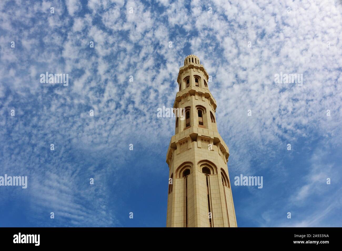 Sultan Qaboos Grand Mosque one of the high tower of the wall sourrounding the mosque Stock Photo