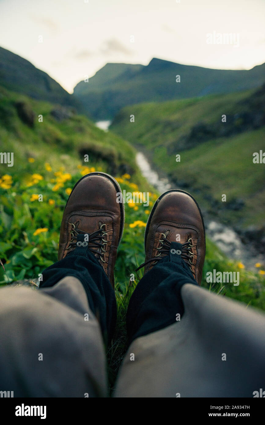 Person wearing hiking boots Stock Photo Alamy