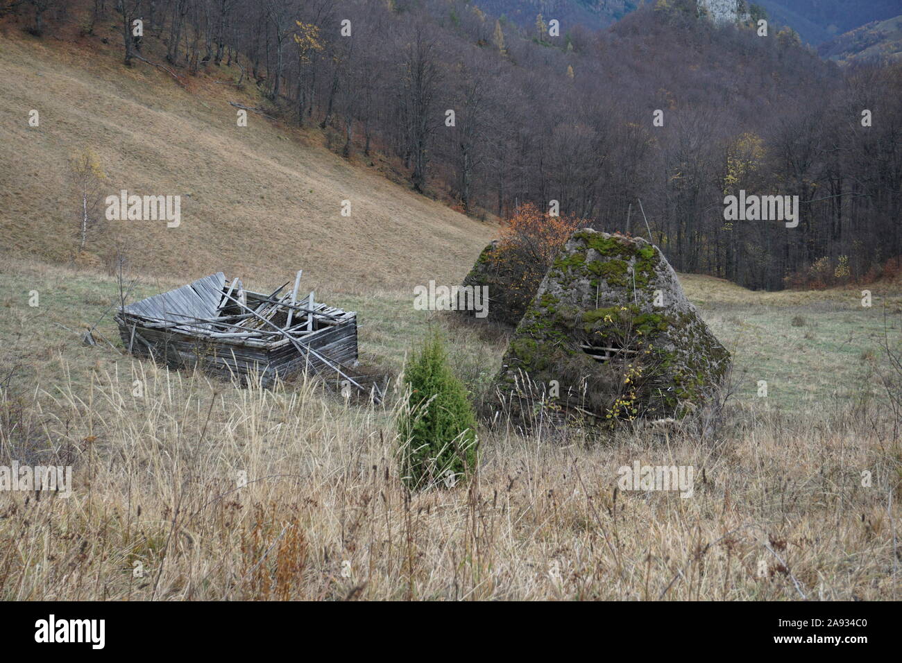 Changing of the seasons. Fall in the mountains. Old countryside house. Stock Photo