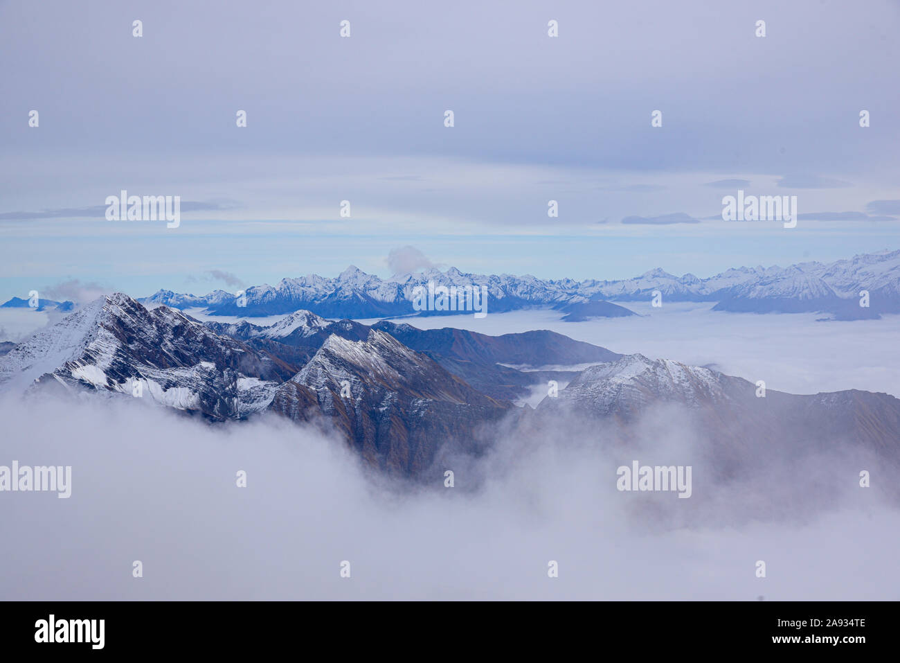 Monte Bianco, Italy. Aerial view of the Alps surrounded by clouds. Stock Photo