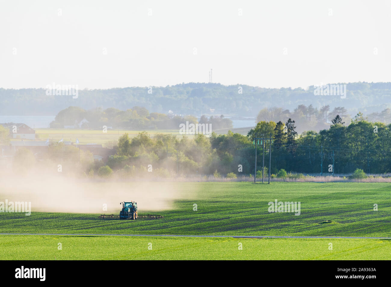 Tractor on field Stock Photo - Alamy