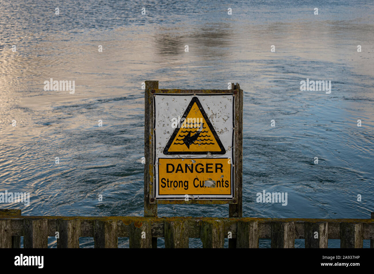Danger strong currents sign by the River hamble in Hampshire Stock Photo
