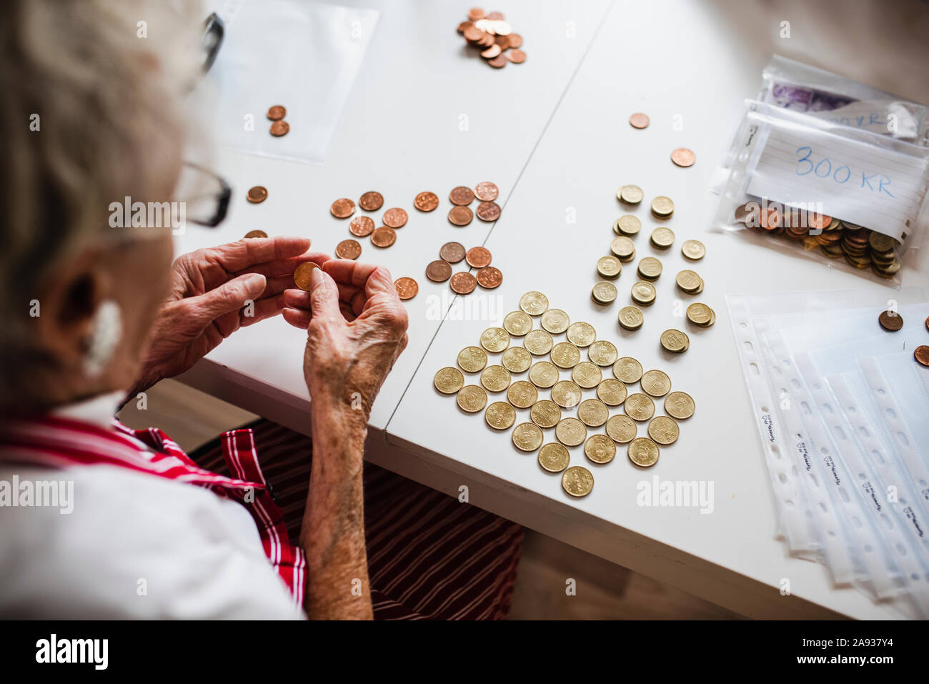 Woman counting coins Stock Photo