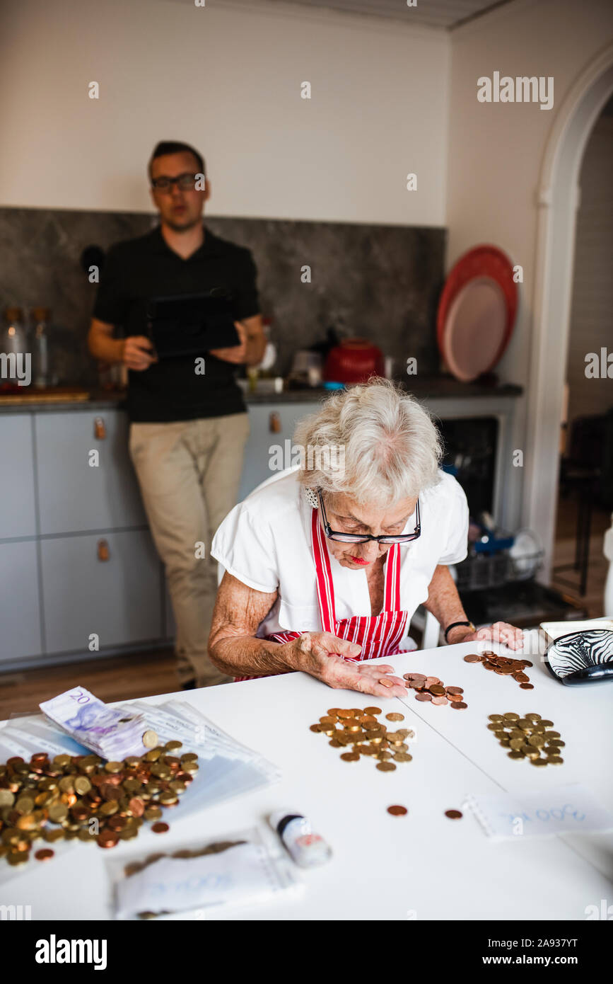 Old man young woman money hi-res stock photography and images - Alamy