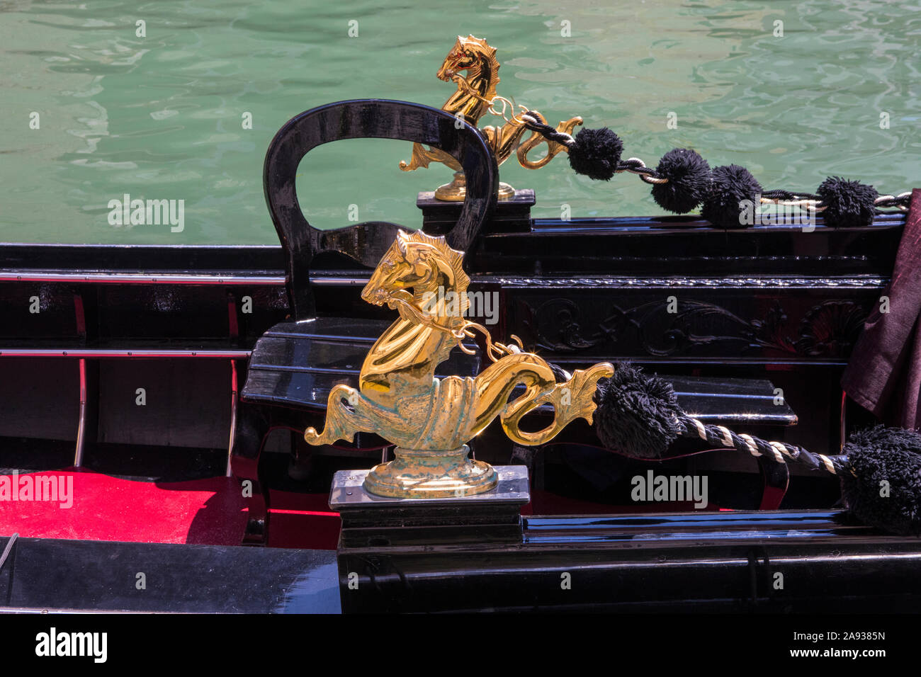 Beautiful golden sculptures of a Gondola in the historic city of Venice ...