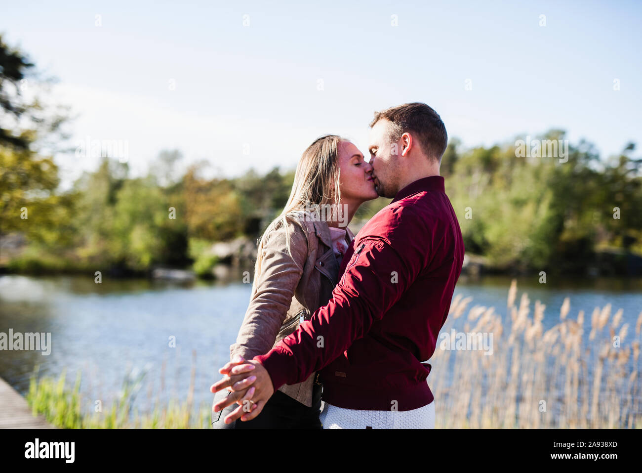 Blonde couple young kissing hi-res stock photography and images - Alamy