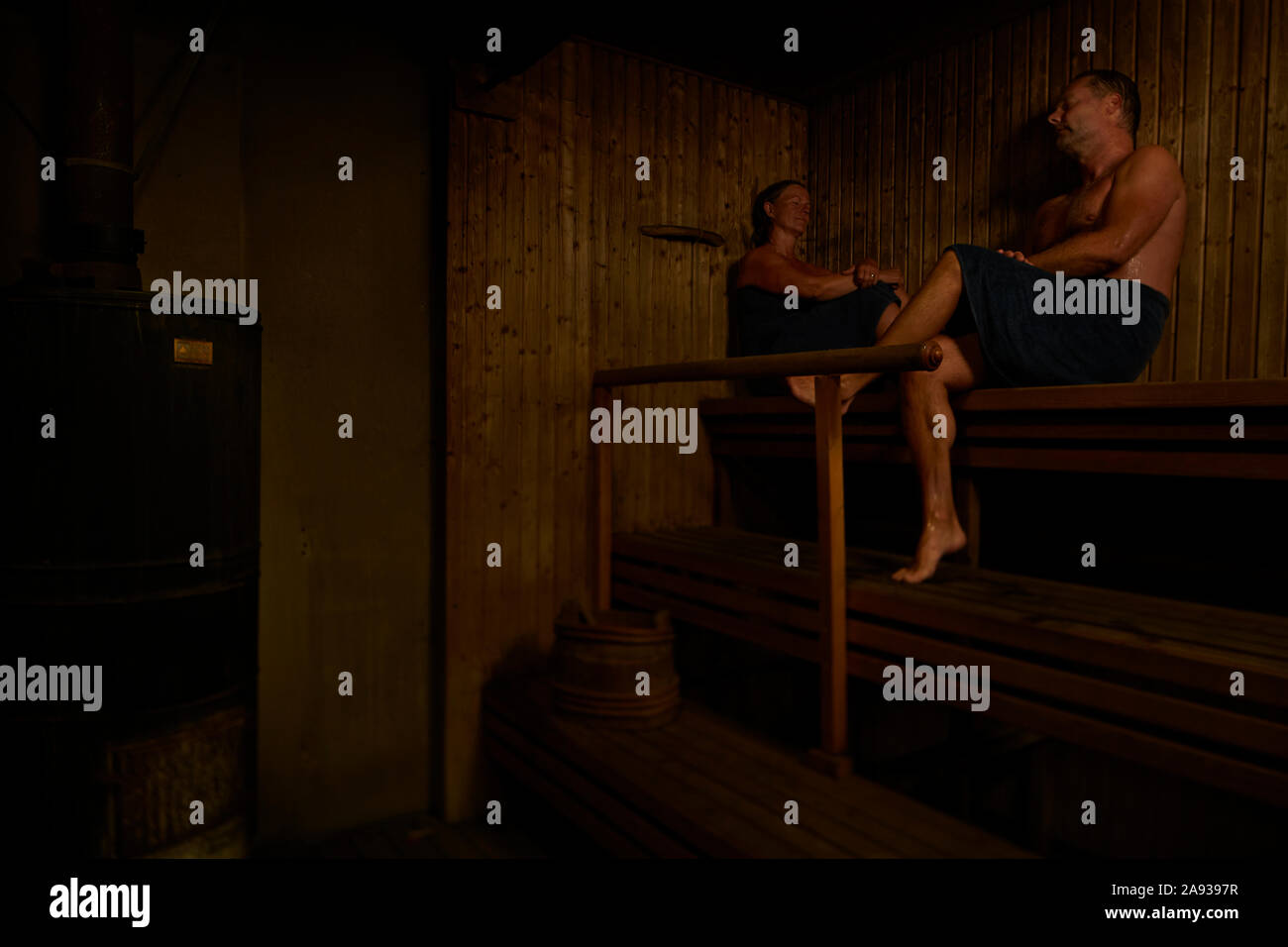 Couple relaxing in sauna Stock Photo