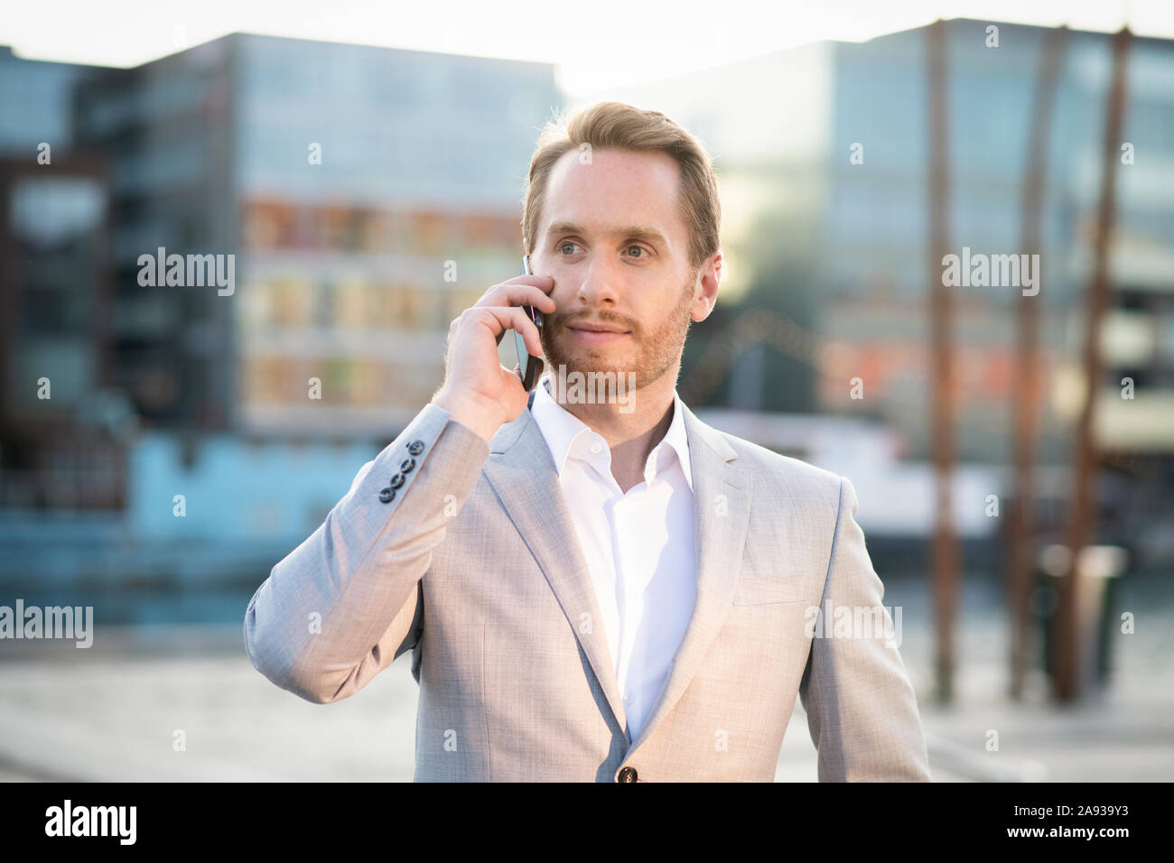 Businessman talking via cell phone Stock Photo