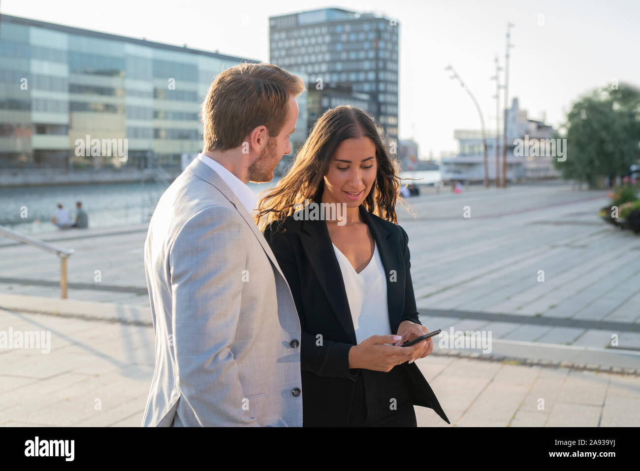 Business people using cell phone Stock Photo