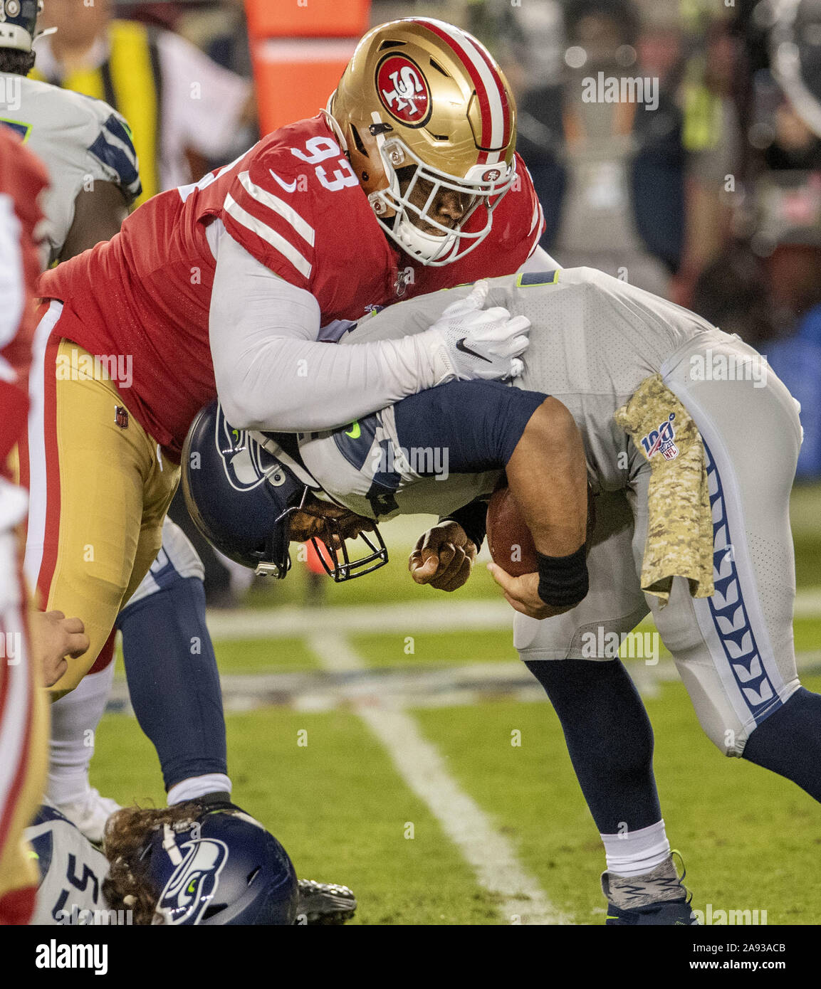 Santa Clara, California, USA. 11th Nov, 2019. San Francisco 49ers defensive  tackle D.J. Jones (93) sacks Seattle Seahawks quarterback Russell Wilson  (3) on Monday, November 11, 2019, at Levis Stadium in Santa