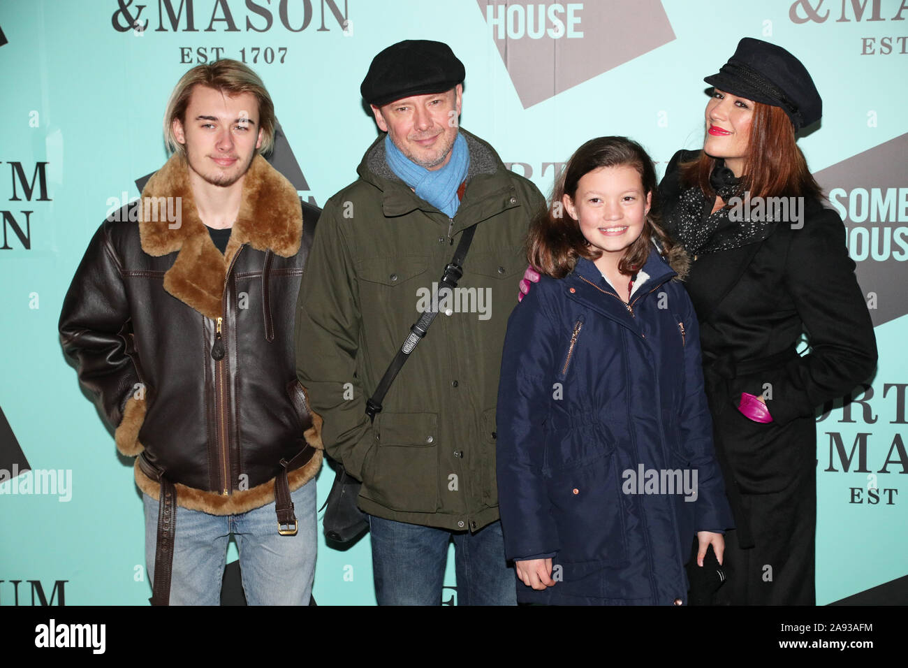 John Simm (second left) with his son Ryan Simm (left), daughter Molly Simm (second from right) and wife Kate Magowan, arriving at the launch of Skate at Somerset House with Fortnum & Mason, at Somerset House, London. Stock Photo