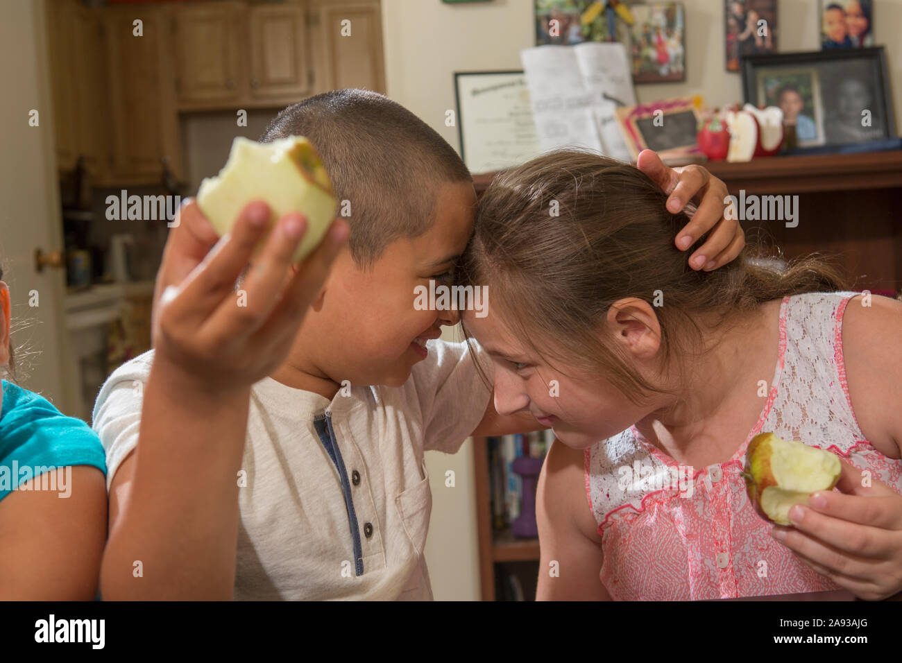Hispanic boy with Autism playing with his sister at home Stock Photo