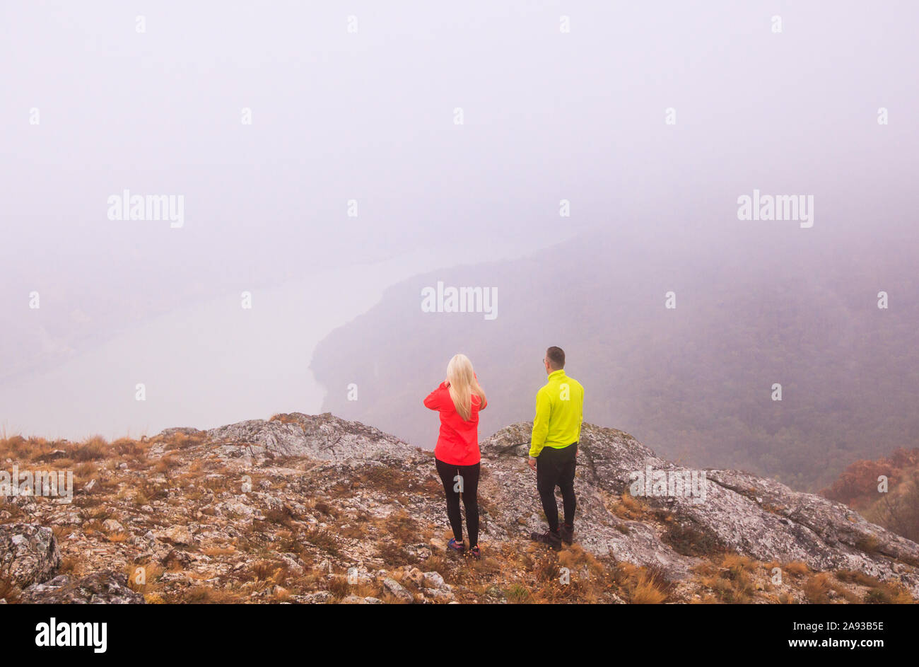 Healthy active lifestyle. Hiking. Beautiful nature landscape. View on misty Danube river from peaks. Location travel Serbia. Stock Photo