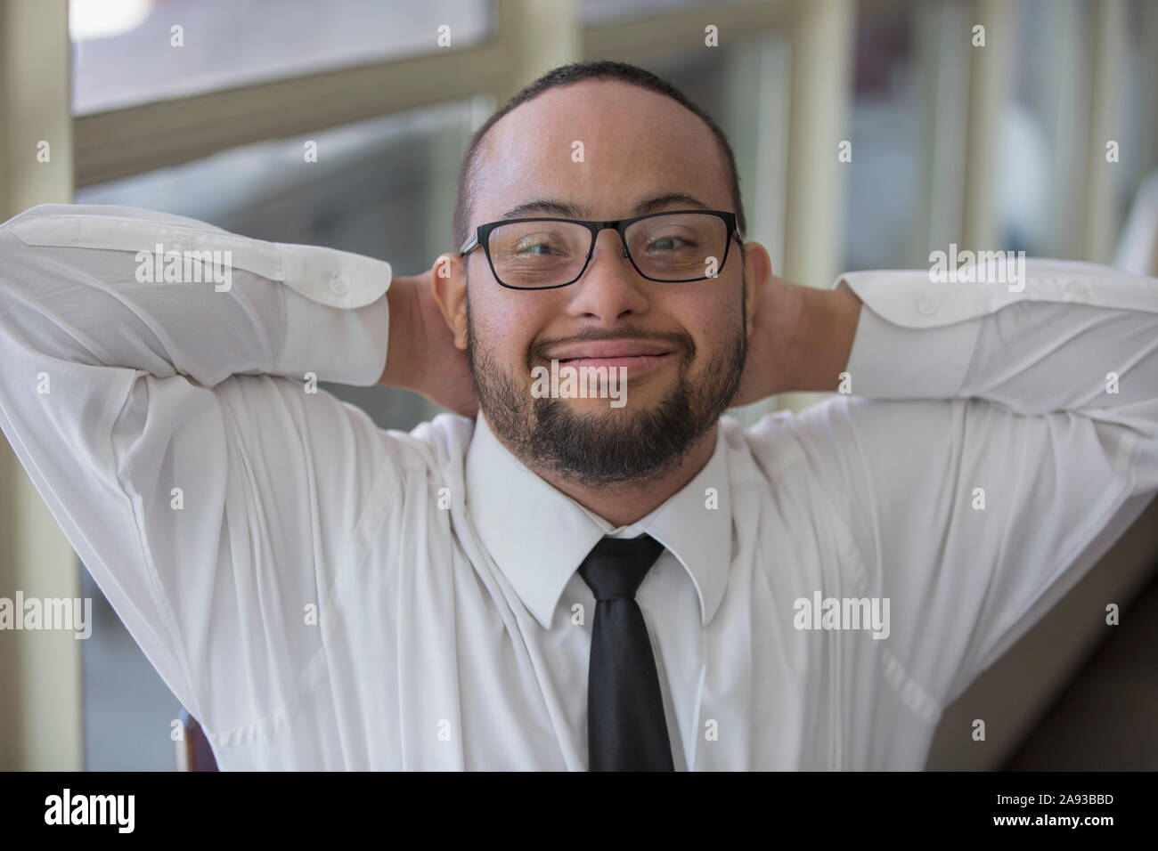 portrait-of-happy-african-american-man-with-down-syndrome-as-a-waiter
