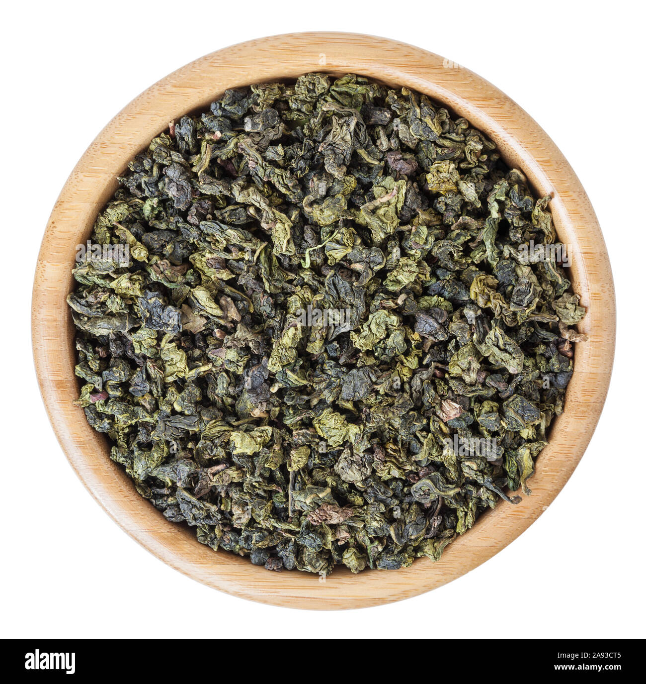 Milk oolong green tea in wooden bowl isolated on white background with