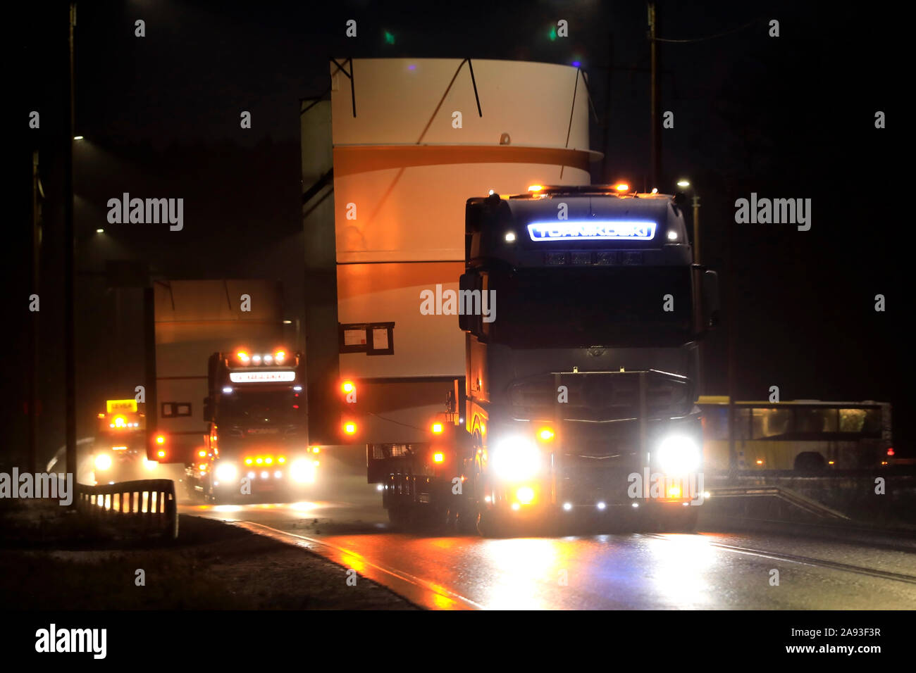 Convoy of two oversize load transports of a 5,5 m high steel frame with