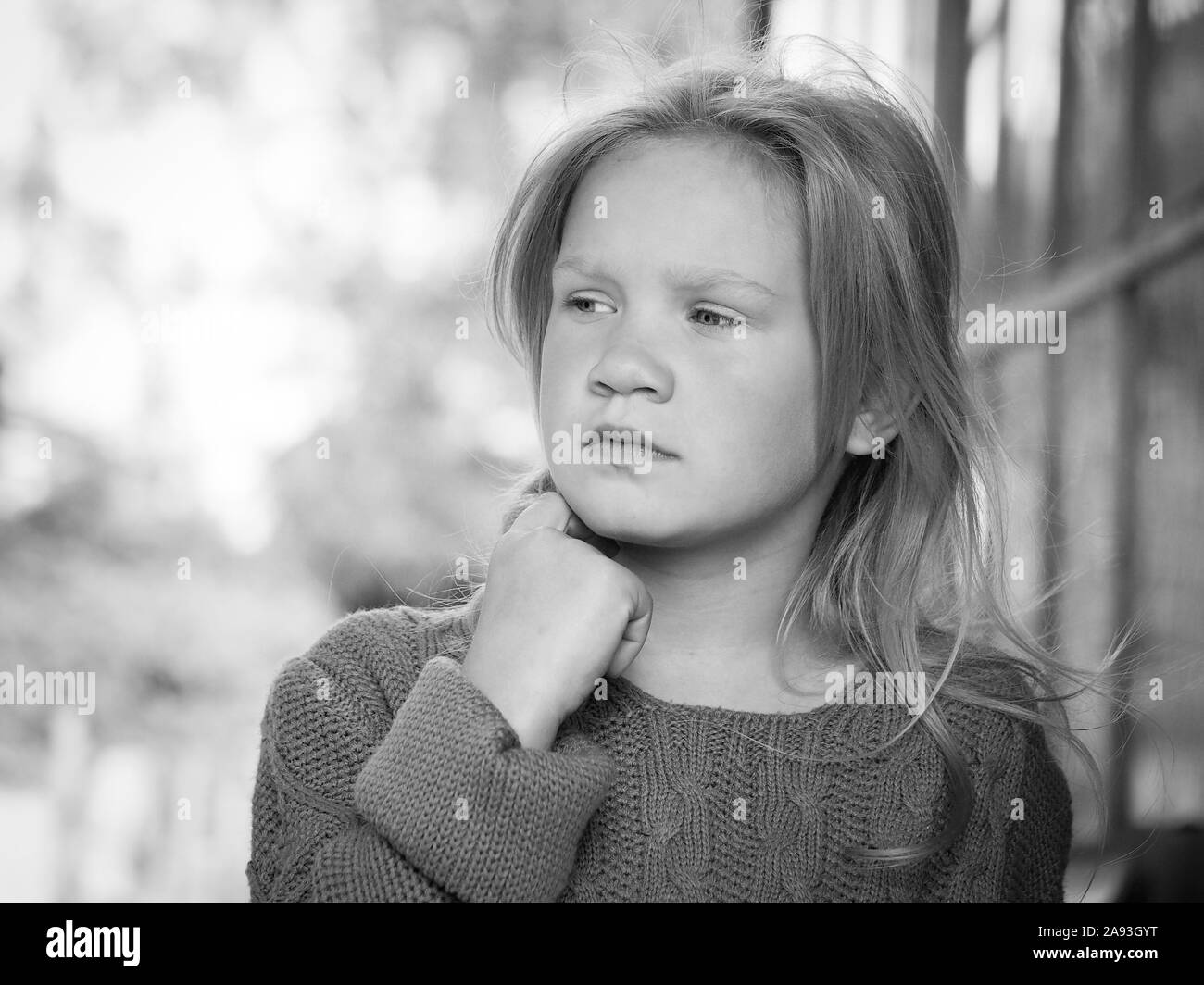 Portrait of a girl. The child looks away thoughtfully. Beautiful face and hair Stock Photo