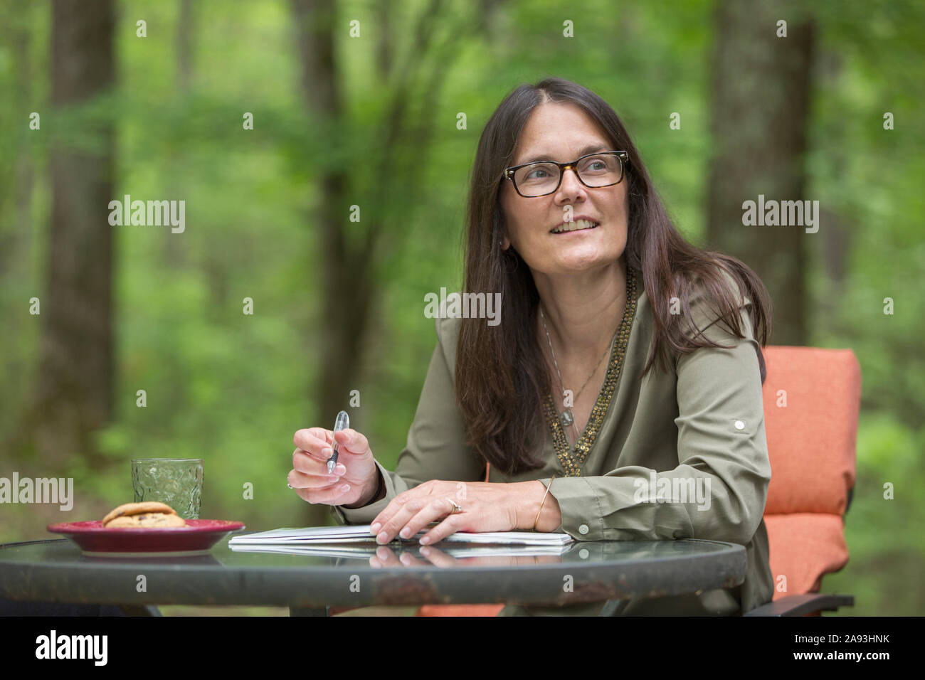 Mature woman thinking writing hi-res stock photography and images - Alamy