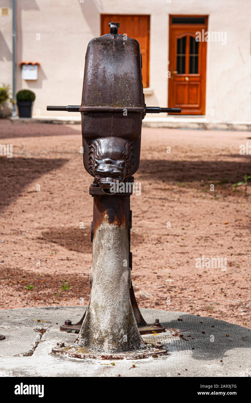 Europe, France, Pommiers, Monastery of Vieux Pommiers, 11th c., Castelated monastery, fortified, water fountain, cast iron, crank, cranked, hand Stock Photo