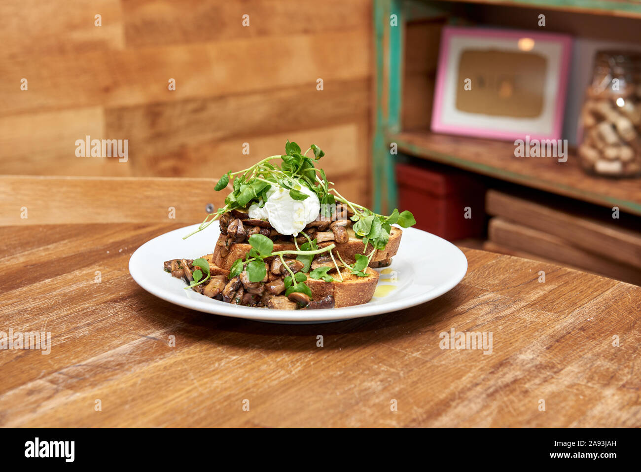 Mushrooms on toast with a poached egg Stock Photo
