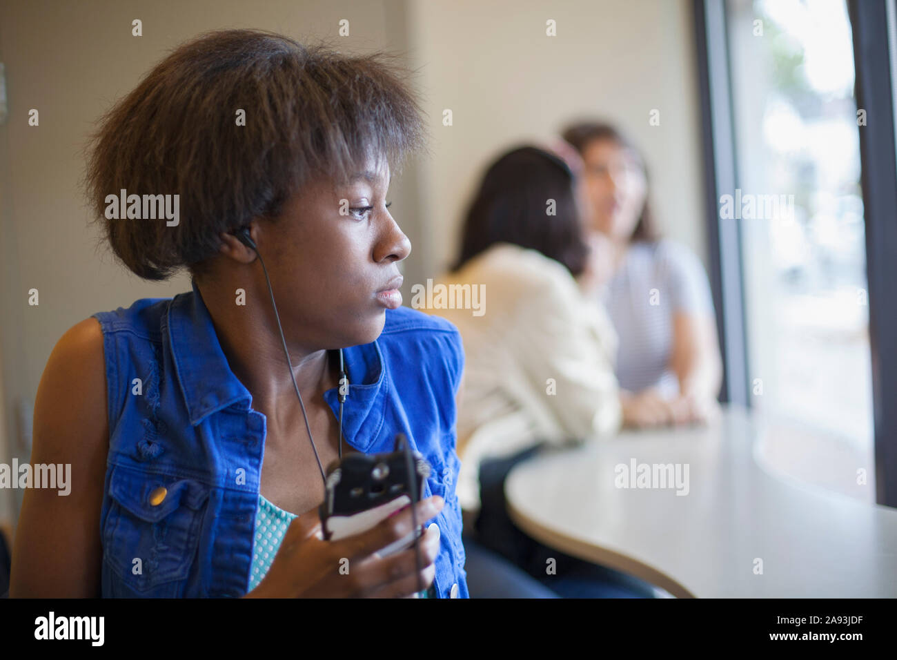 Woman with Learning Disability listening to music Stock Photo