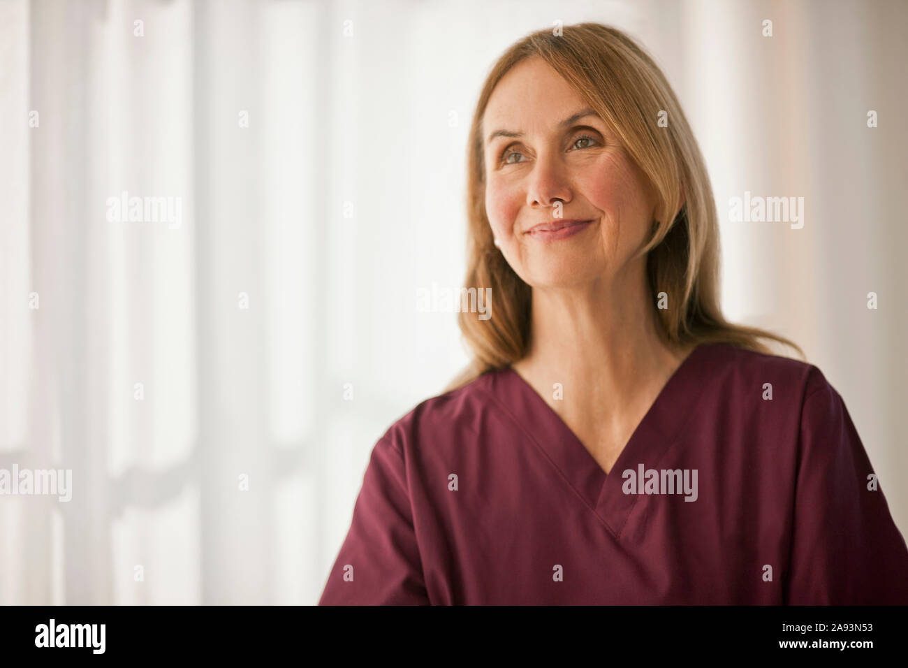 Cheerful female medical expert hi-res stock photography and images - Alamy
