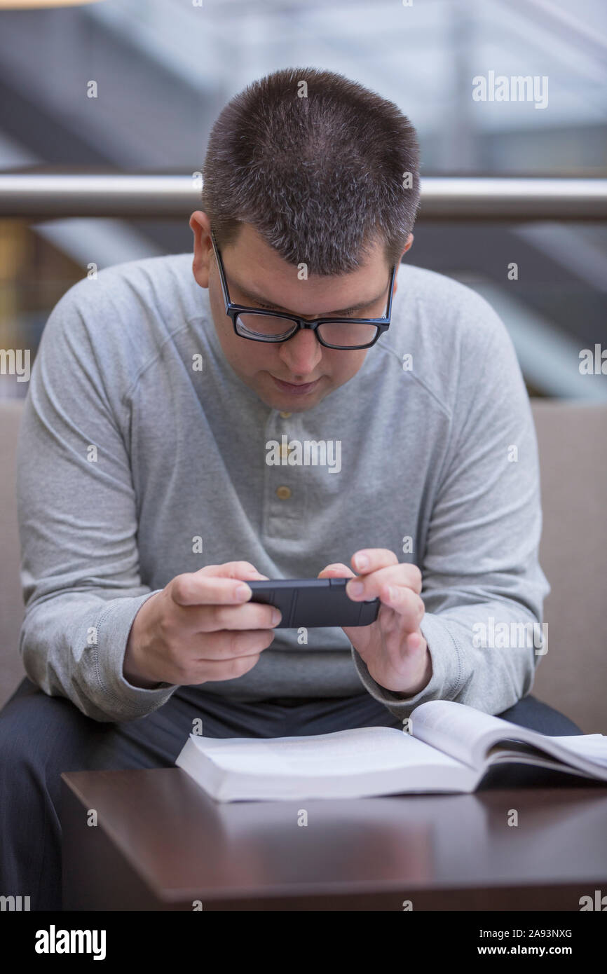 Man with Visual Impairment studying at school Stock Photo