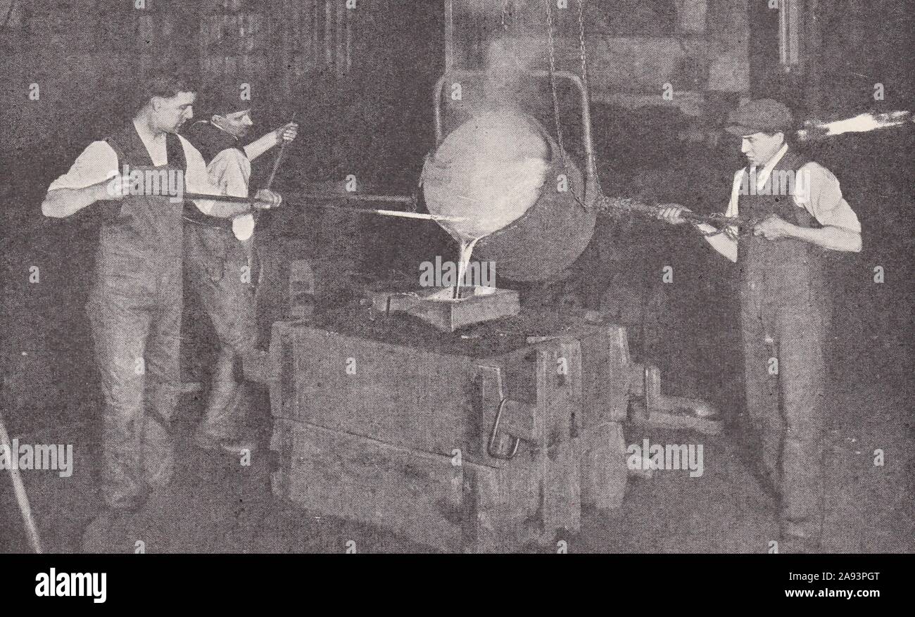 Smelting - Molten metal being poured into a mould 1930s Stock Photo - Alamy