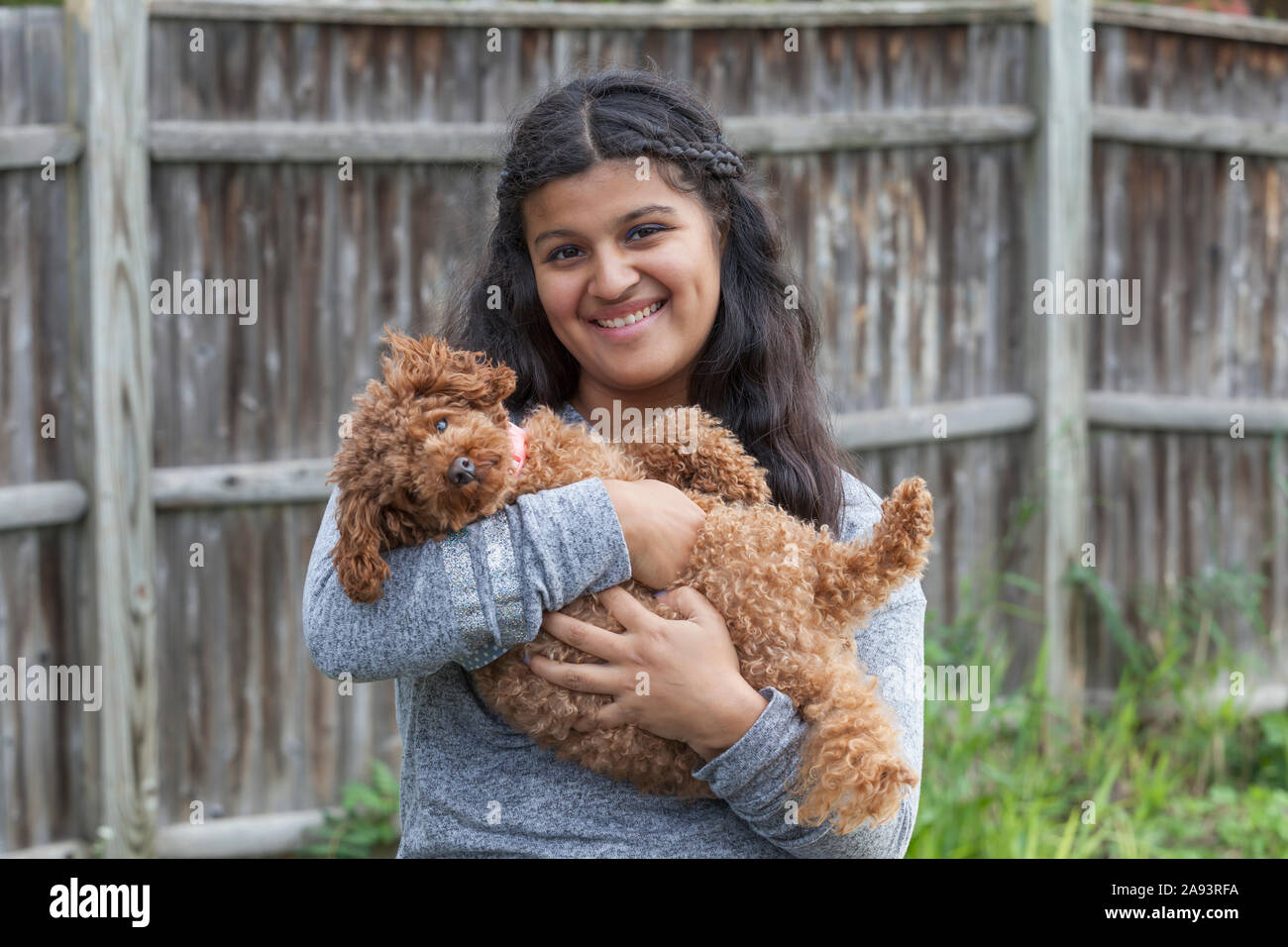 Teen with Autism and her pet Stock Photo - Alamy
