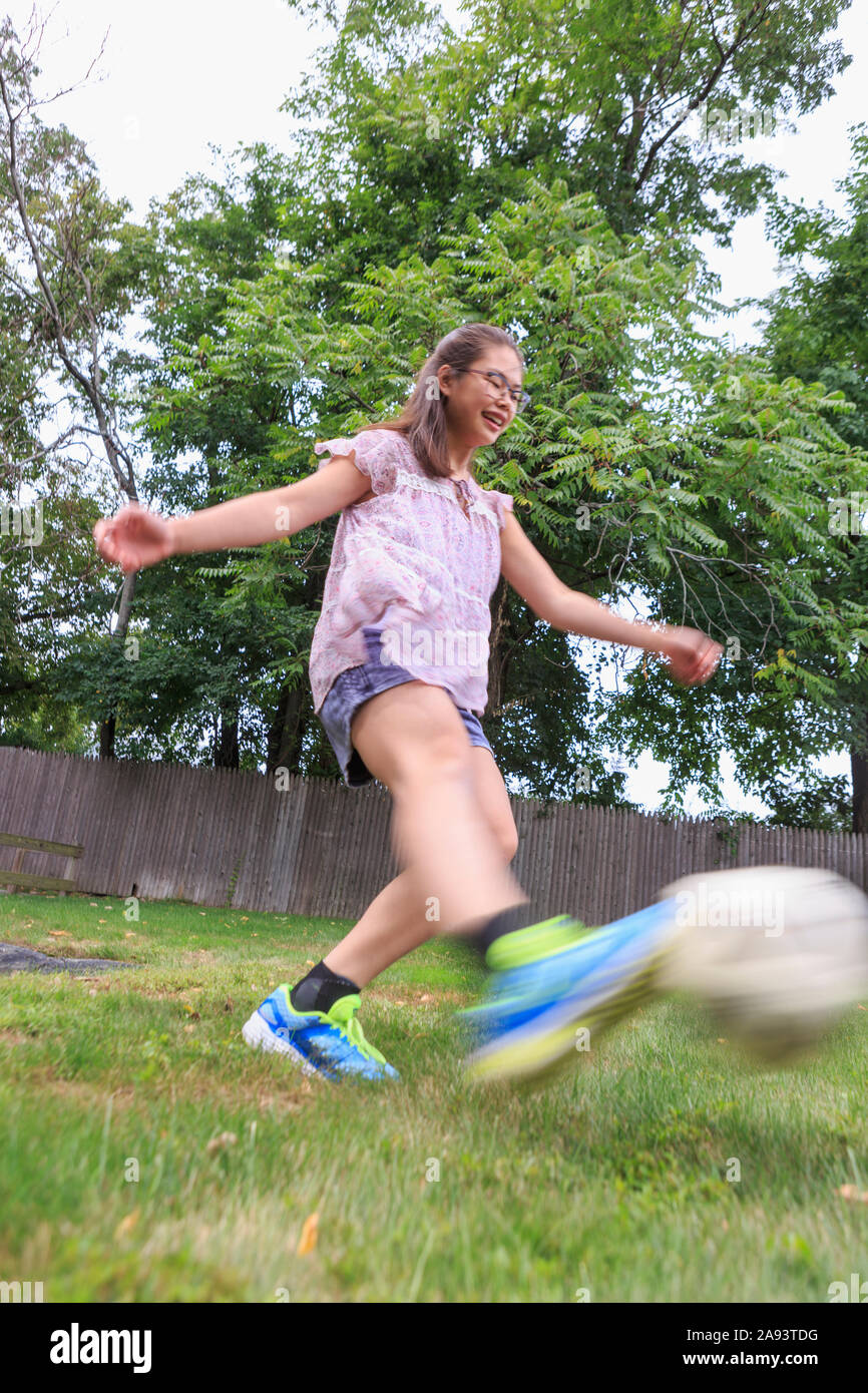 Teen girl who has Learning Disability playing soccer Stock Photo