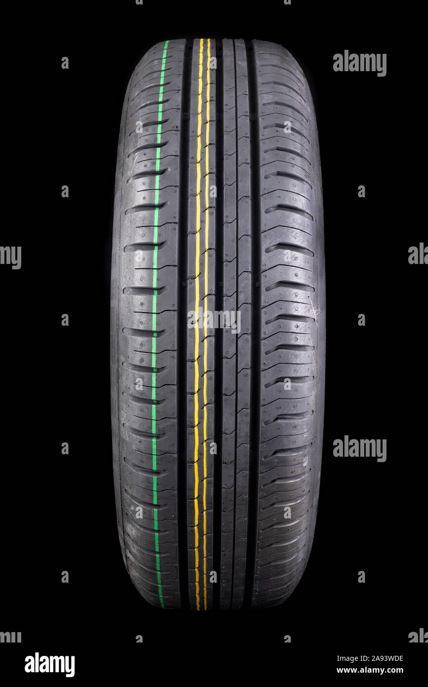 New black tire with deep tread. Car tires. Dark background Stock Photo ...