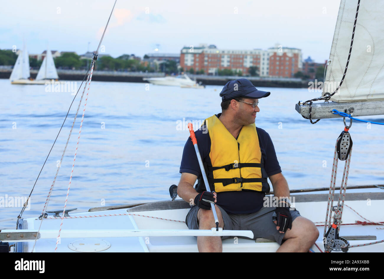 Blind man on sailing boat Stock Photo