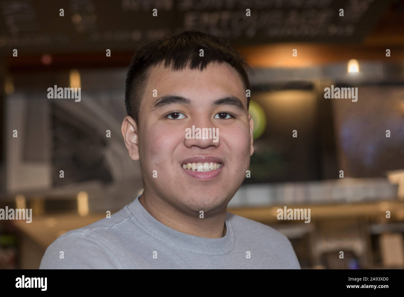 Young man with Autism working in a restaurant Stock Photo - Alamy