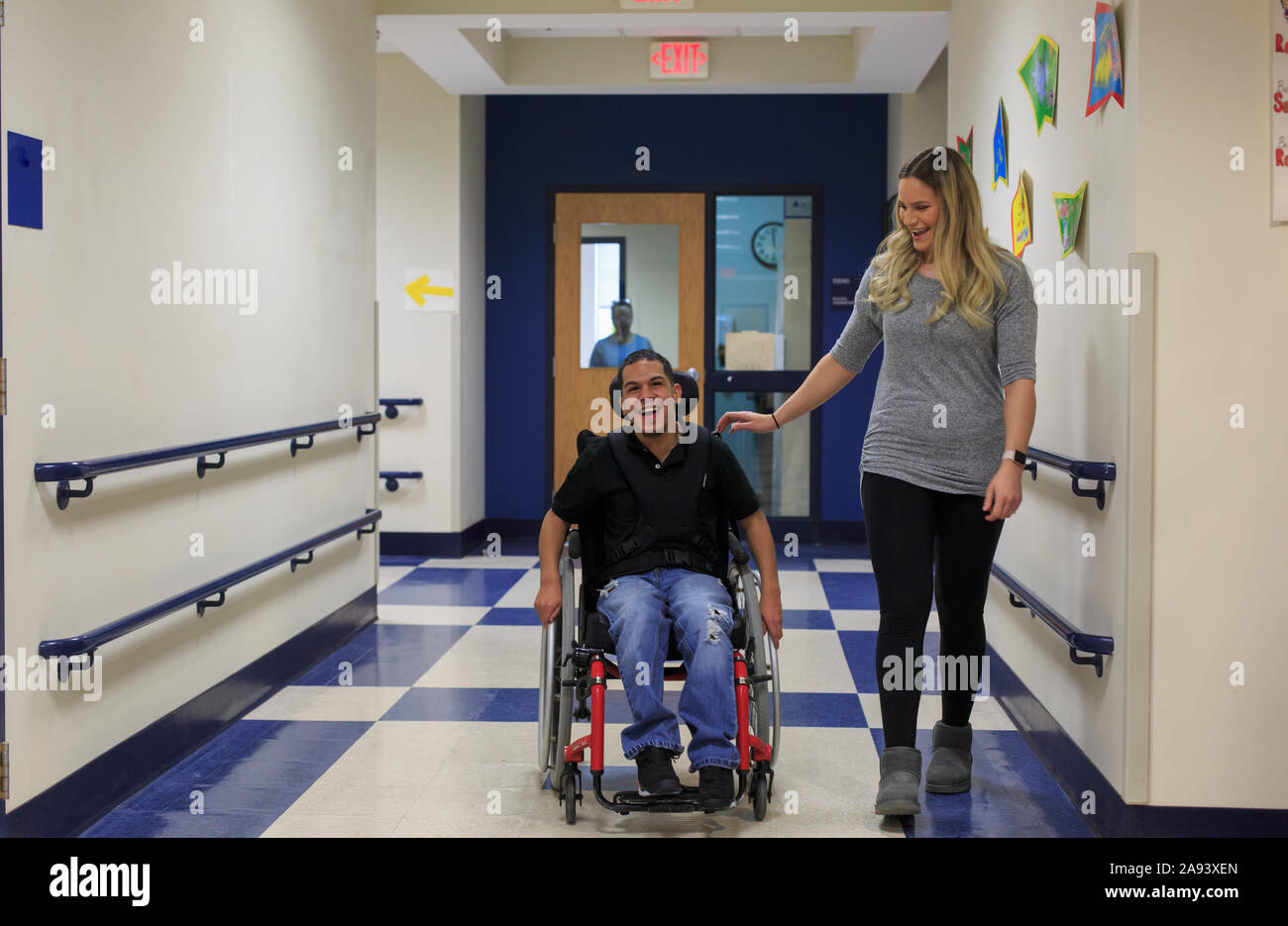 Boy with Spastic Quadriplegic Cerebral Palsy walking down hall at ...