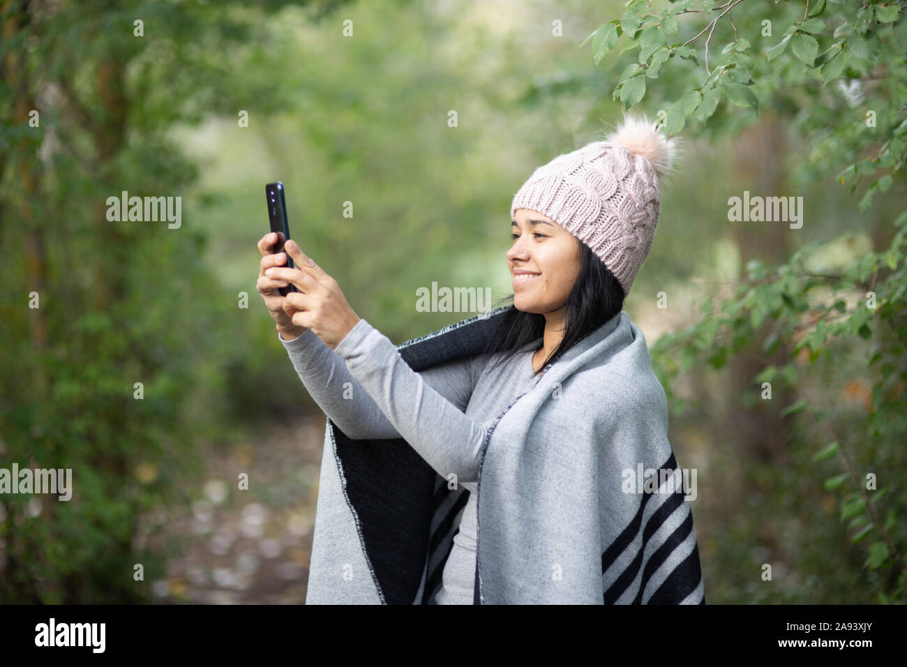 happy young woman taking selfie Stock Photo - Alamy