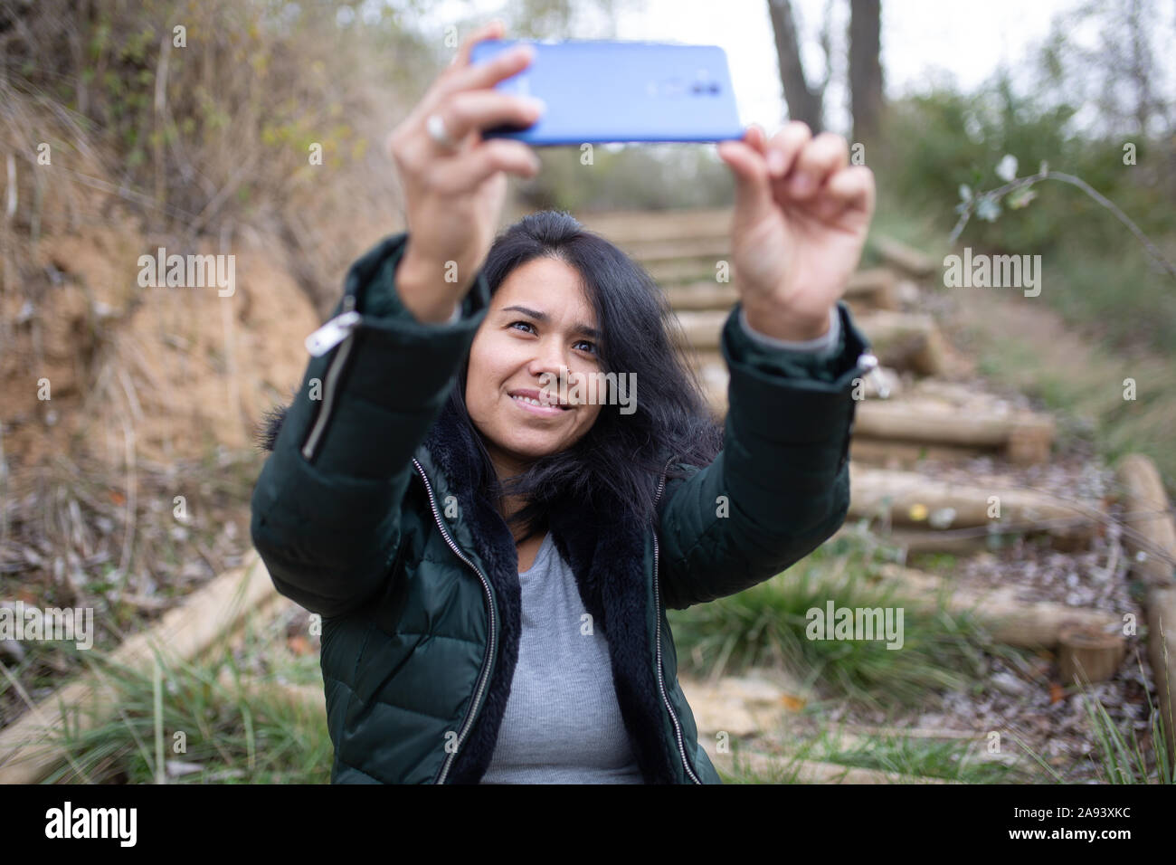 happy young woman taking selfie Stock Photo - Alamy