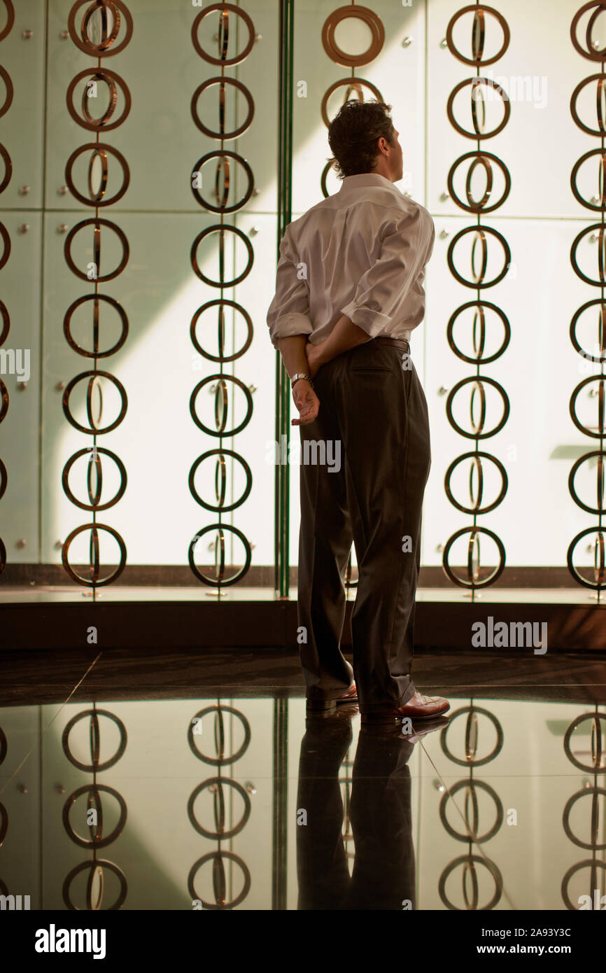 Thoughtful businessman standing in an office. Stock Photo
