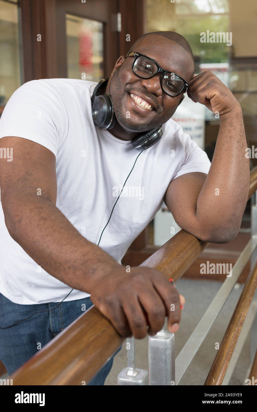 Man with ADHD wearing headphones Stock Photo