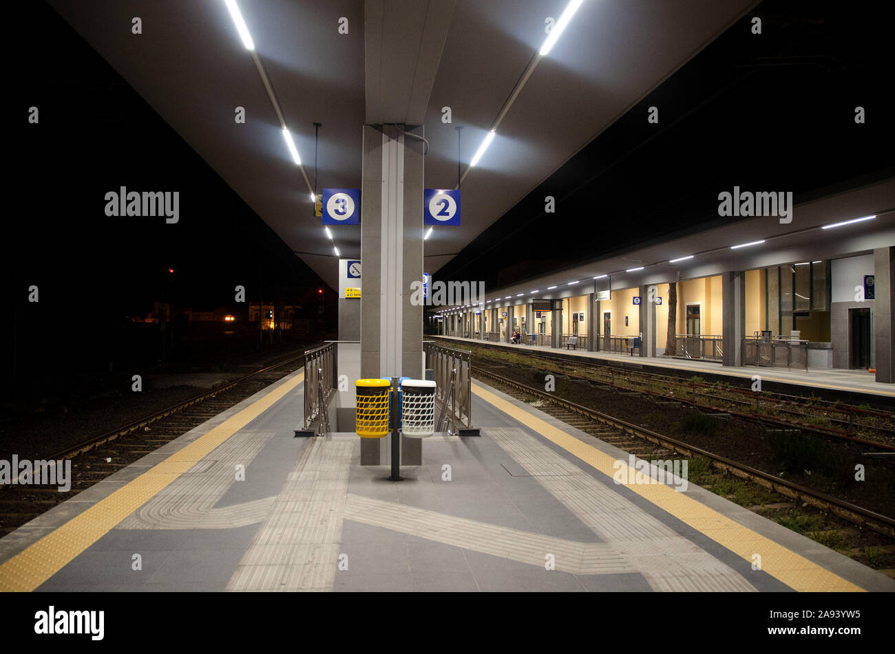 A modern lighted train station in  Giarre riposto in sicily italy Stock Photo