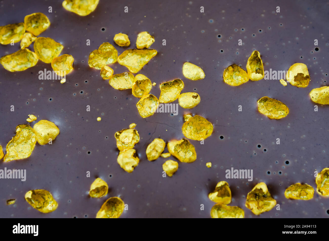 Real Gold flakes seen on the chocolate layered desert. Eatable gold