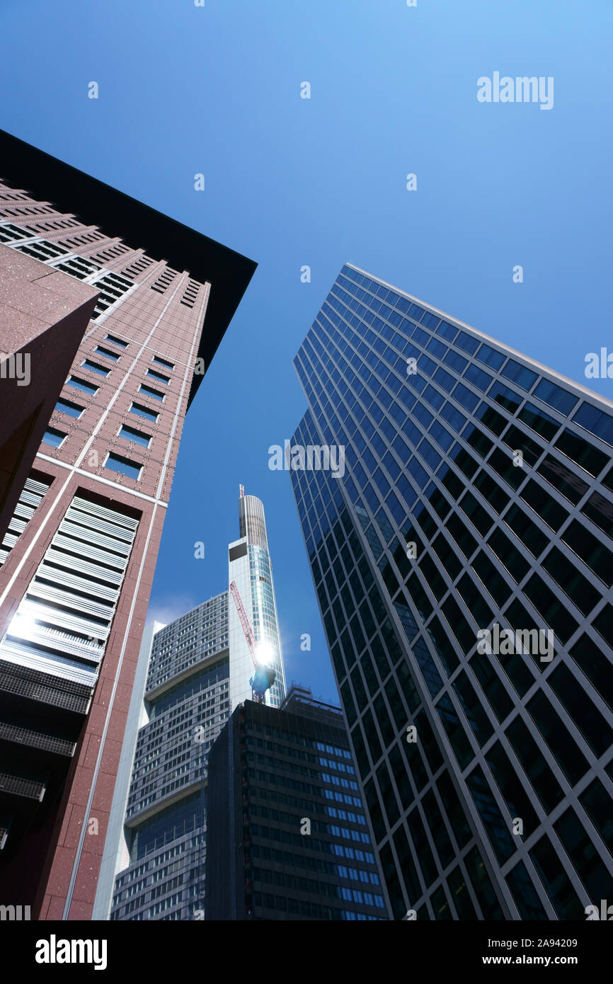 The underside and under view of the Japan Center skyscraper and the commerzbank tower in Frankfurt surrounds from various other skyscrapers. Stock Photo