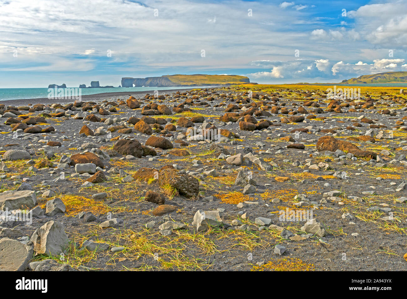 Jumbled Volcanic Rocks on Black Sand Reynisfjara Beach near Vik, Iceland Stock Photo