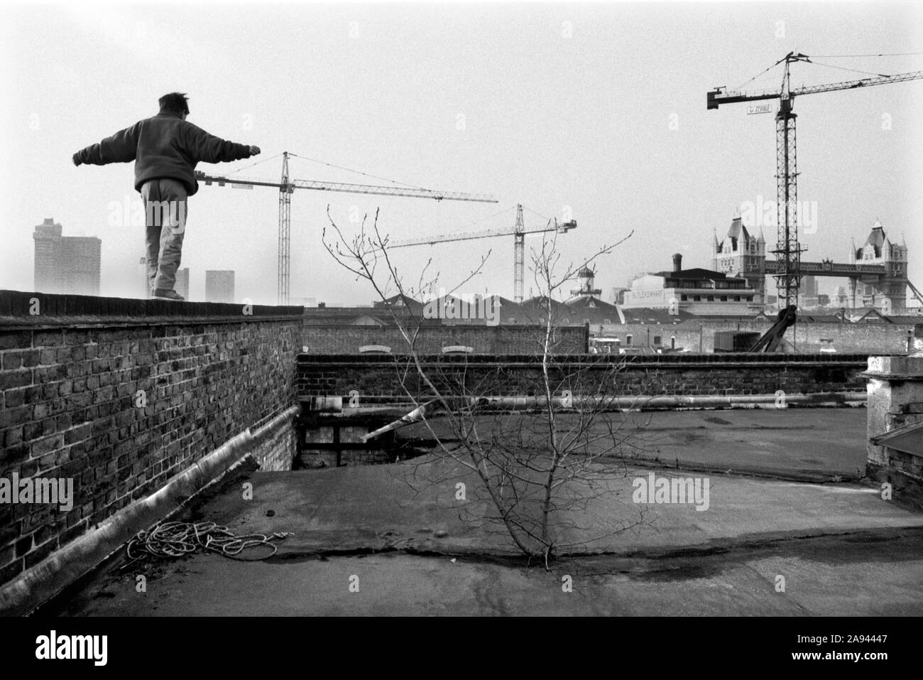 Butlers Wharf  building the Docklands development 1980s London UK.  Derelict warehouse Tower Bridge Southwark, Bermondsey, South East London. 1987  HOMER SYKES Stock Photo