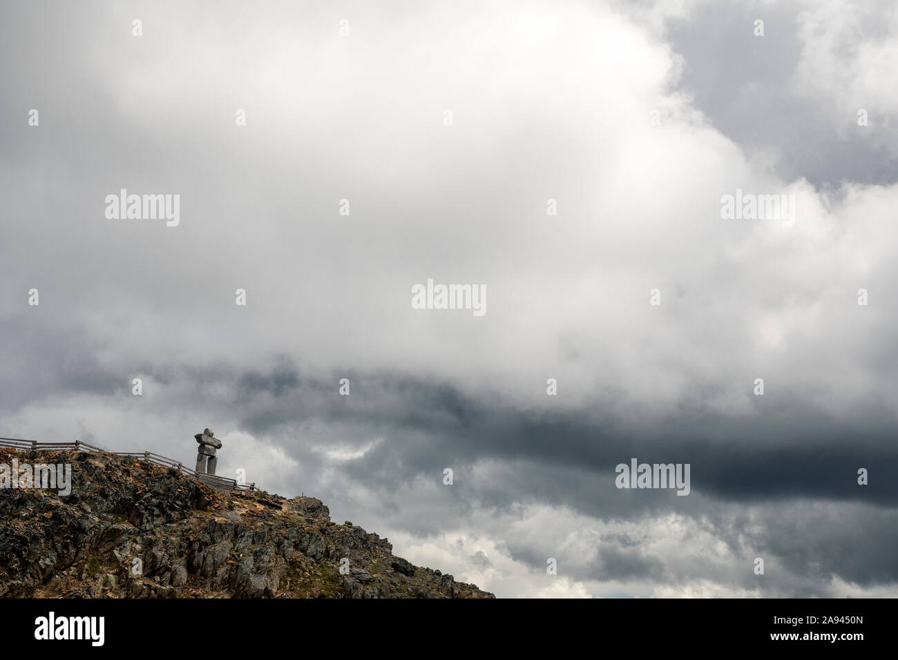 An Inukshuk sits on the top of Whistler Mountain in British Columbia Stock Photo