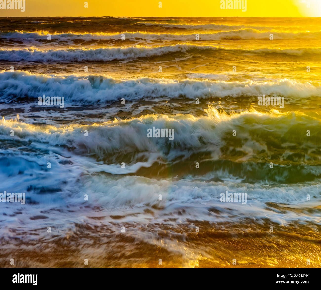 Sunlight over golden ocean hi-res stock photography and images - Alamy
