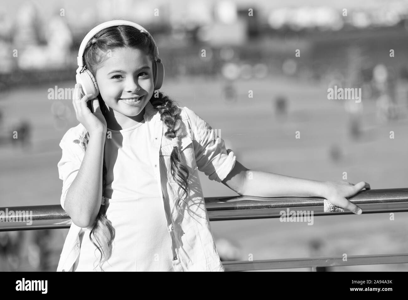 No music so sweet as childs ringing laughter. Adorable music lover wearing  wireless headset. Little child using stereo headphones for listening music.  Music education for small children Stock Photo - Alamy