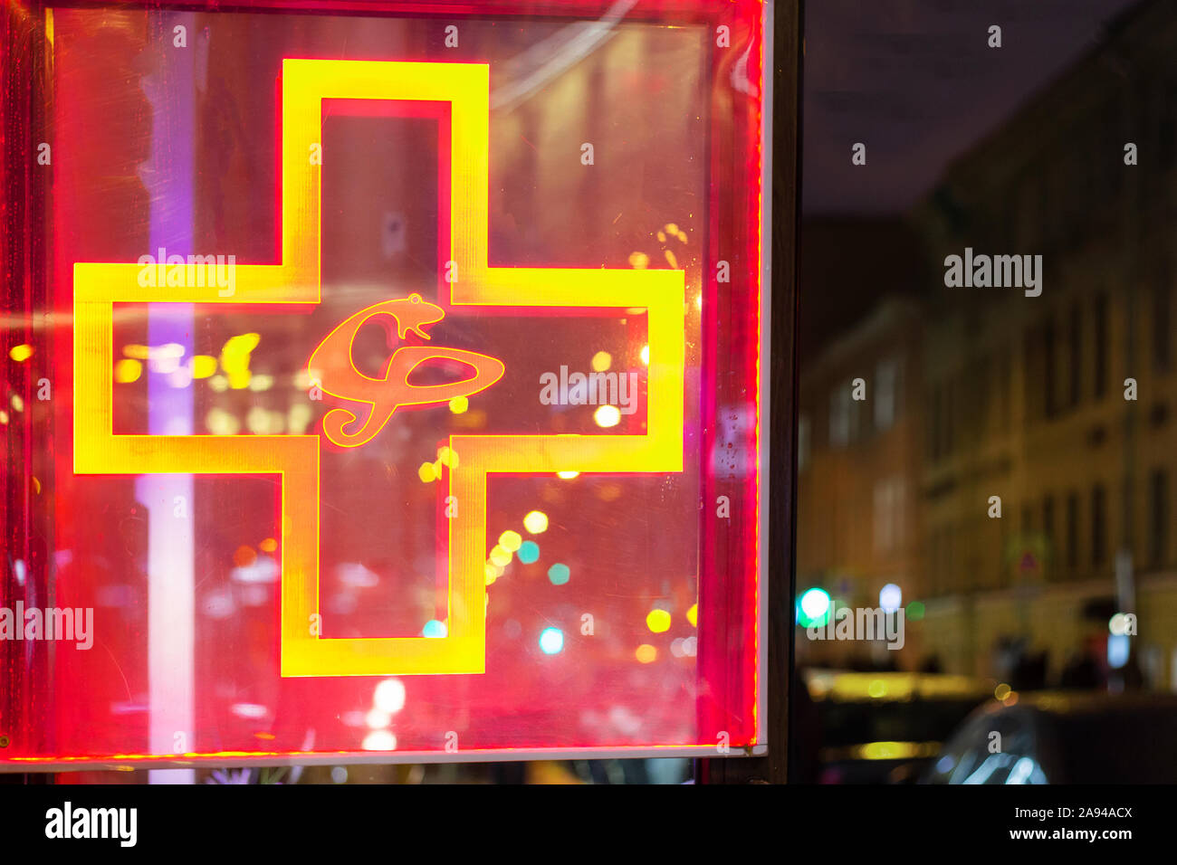medical cross sign neon sign with a snake. illuminated first aid ...